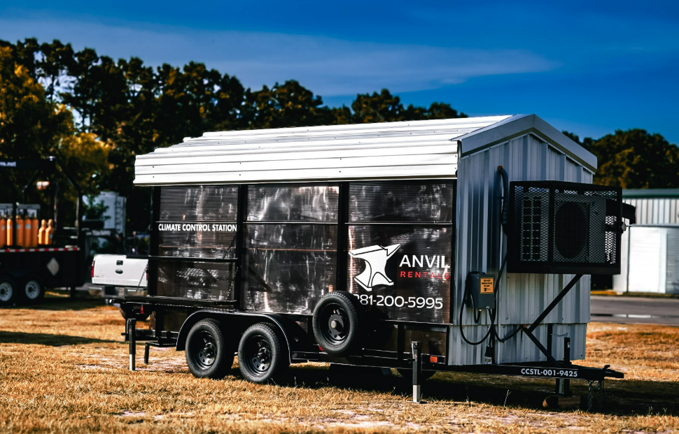 Anvil Rentals climate control station trailer parked outdoors with its exterior air conditioning unit mounted on the end wall